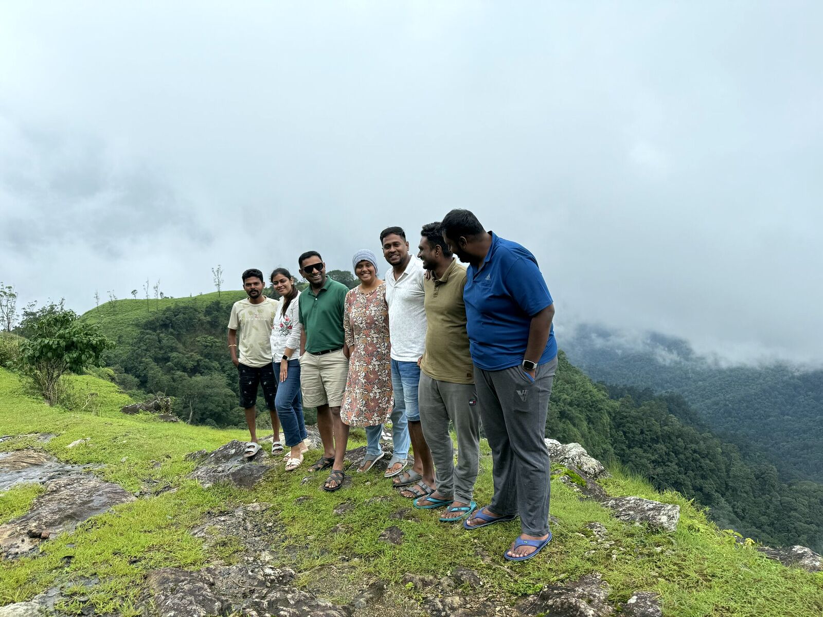 The AyC Tribe standing together on a hill