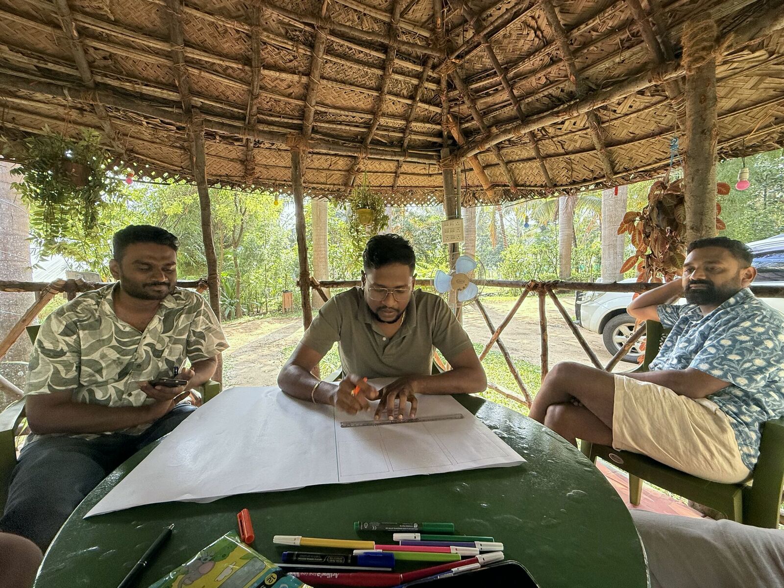 Tribe at hut working